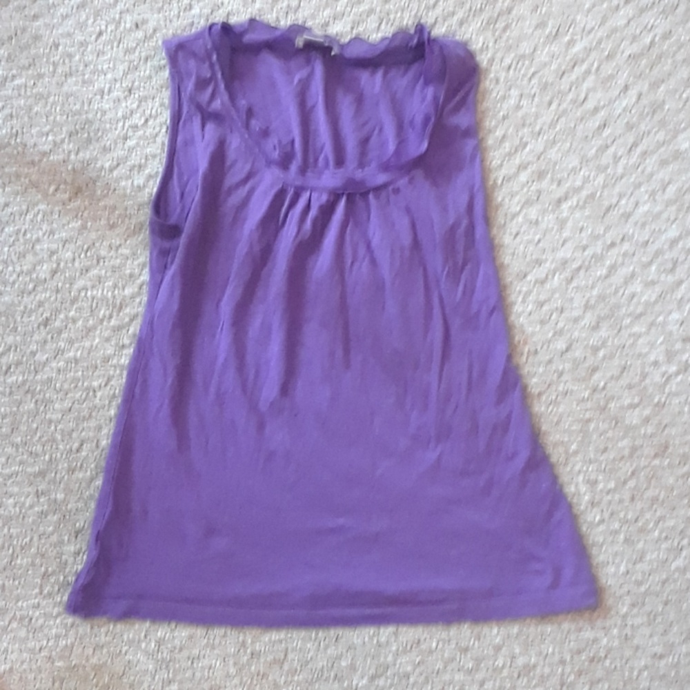A purple shirt with a ruffled